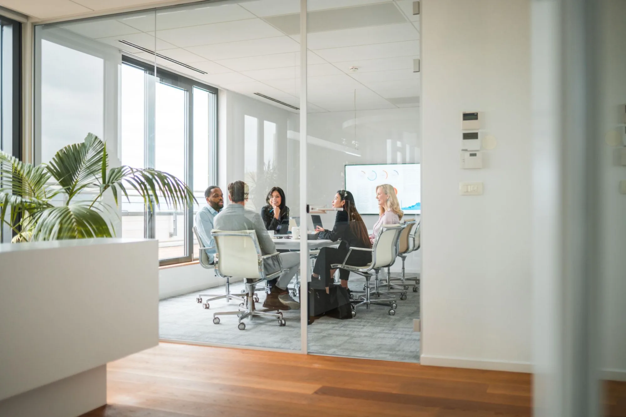 A bright, modern executive boardroom with natural light